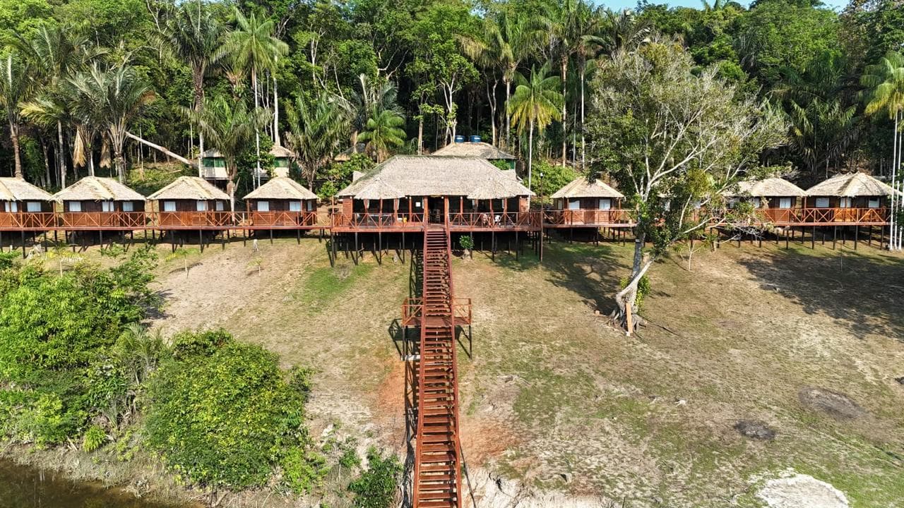 Aerial view of Camaiu Lodge and its cabins among the palms