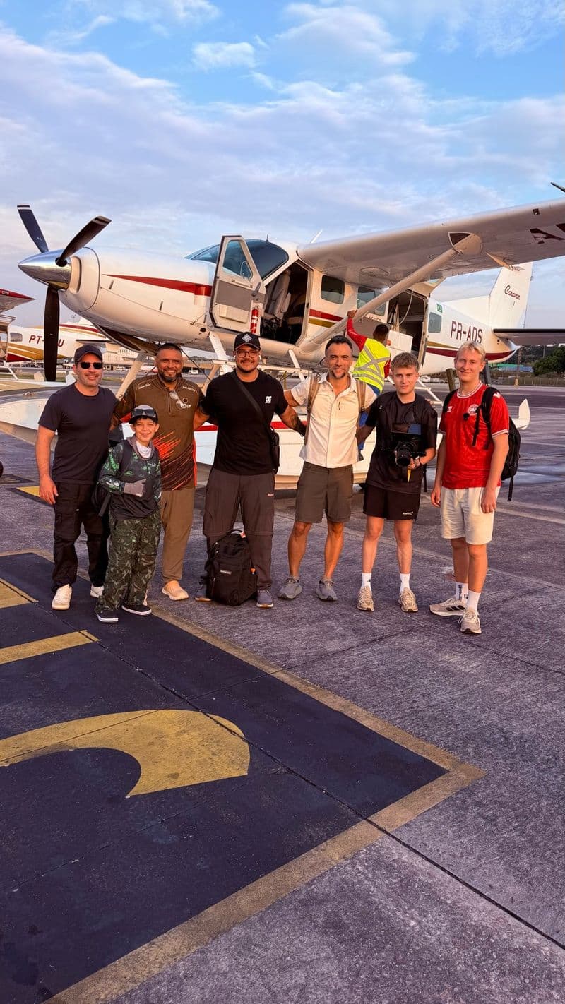 A group of anglers beside the seaplane before departure
