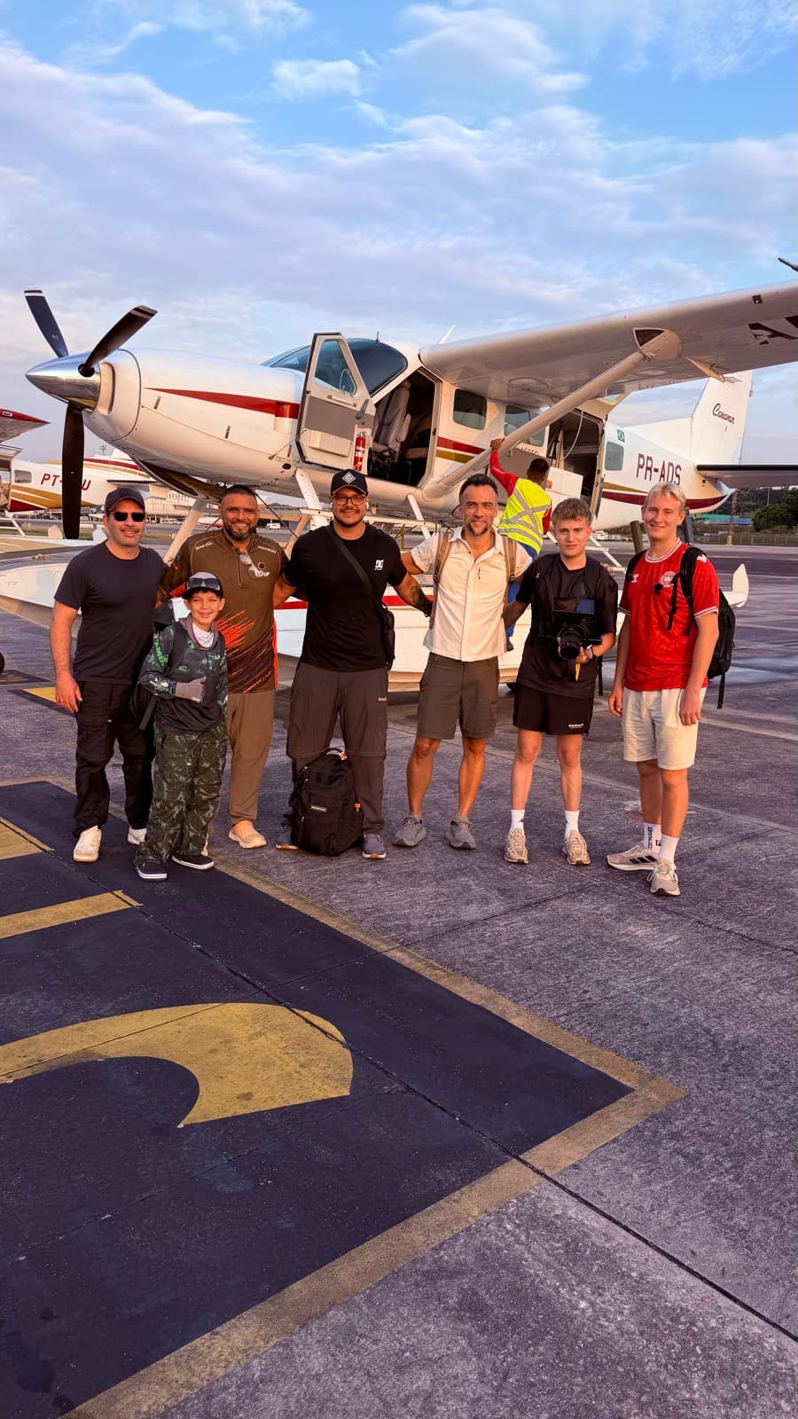 A group of anglers beside the seaplane before departure