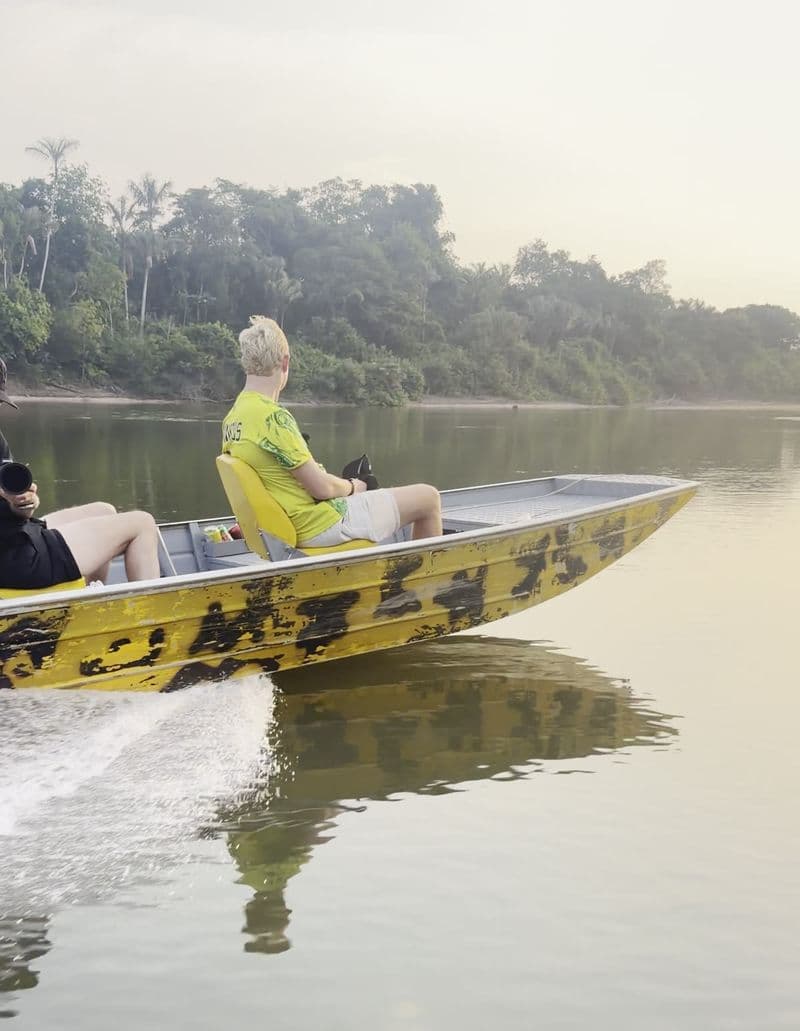 Anglers on a fast boat in the early morning mist