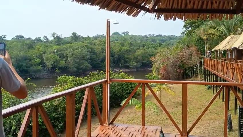Wooden deck of the lodge overlooking the river